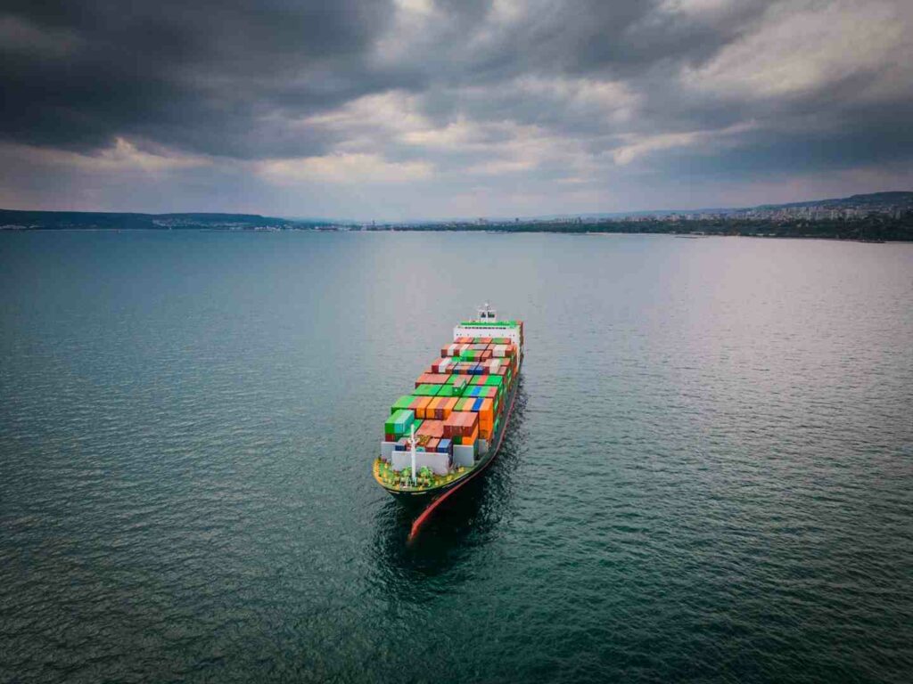 international shipping cargo ship crossing ocean USA to Europe - domestic international shipping